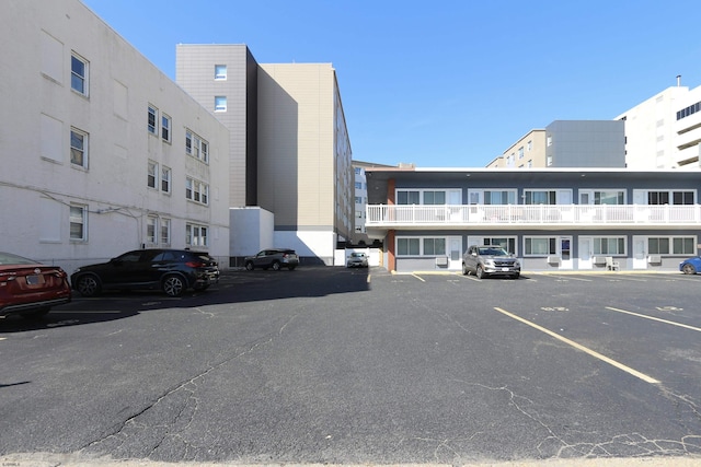 view of building exterior featuring uncovered parking