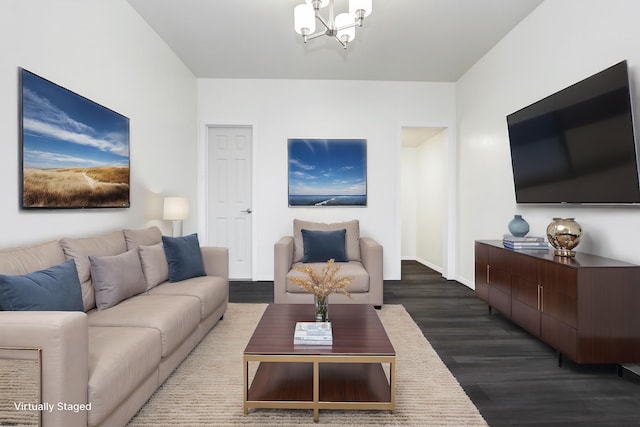 living room with dark wood-style floors, baseboards, and a notable chandelier