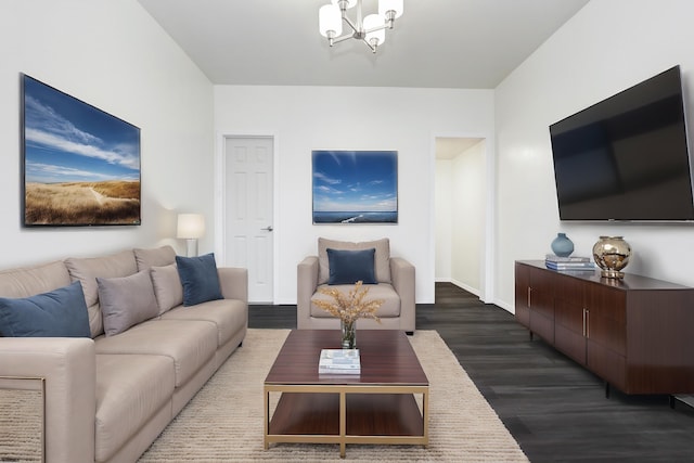 living room featuring a notable chandelier, baseboards, and dark wood-style flooring