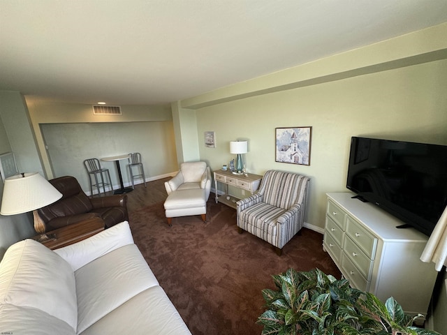 living room featuring baseboards, visible vents, and carpet flooring