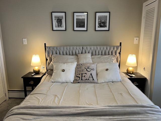 bedroom featuring carpet floors and a baseboard radiator