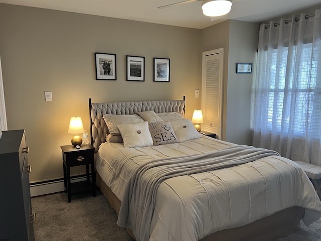 bedroom featuring multiple windows, a ceiling fan, baseboard heating, and carpet flooring