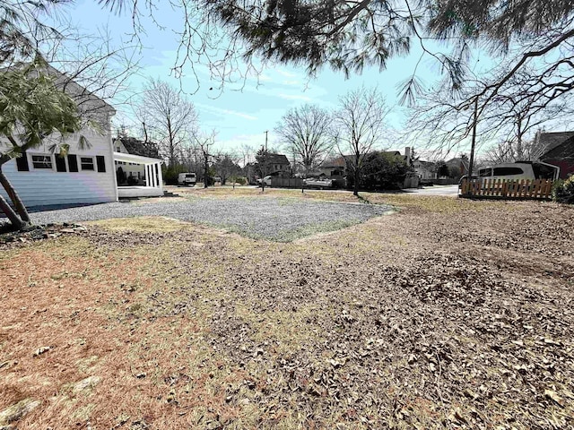 view of yard with gravel driveway