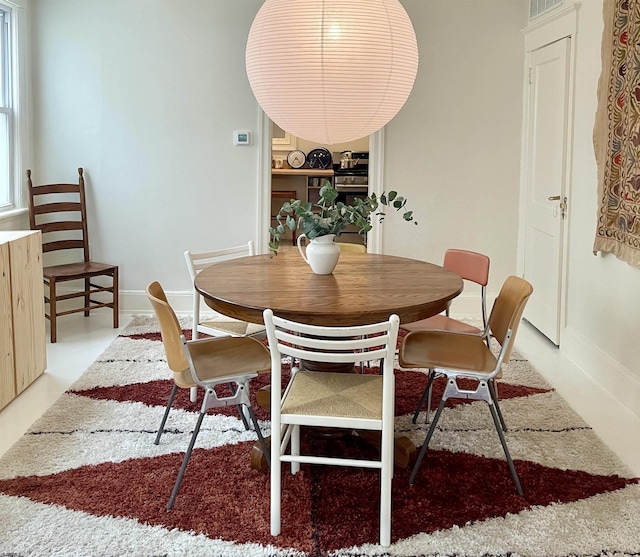 dining room with baseboards