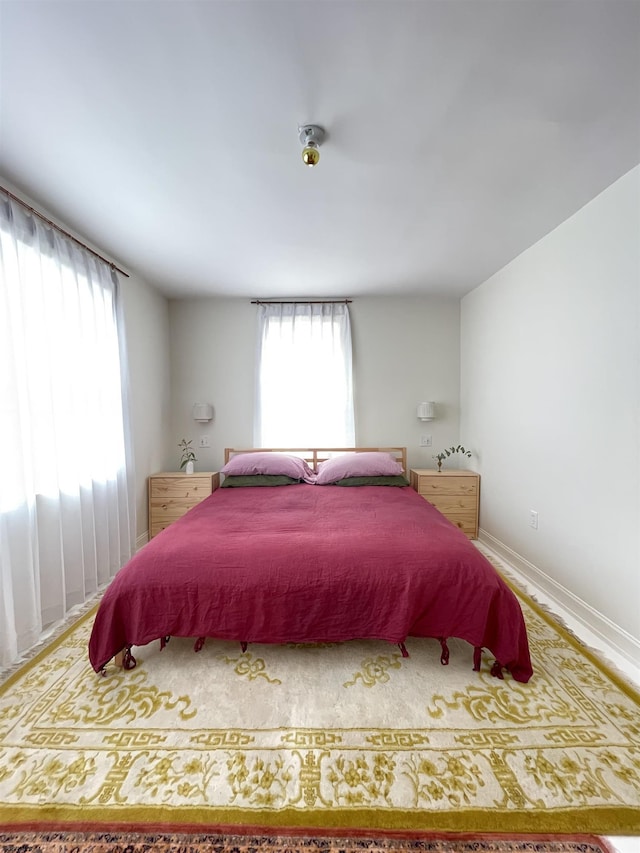 bedroom featuring baseboards