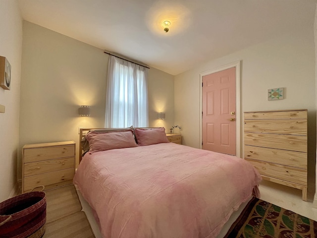 bedroom featuring lofted ceiling