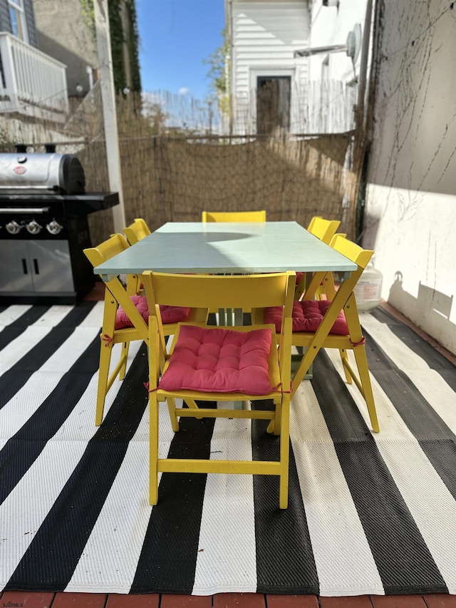 view of patio featuring a grill and outdoor dining space