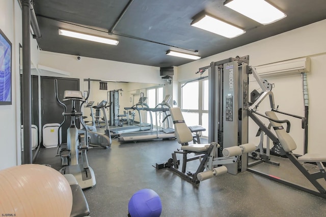 exercise room featuring a wall mounted air conditioner