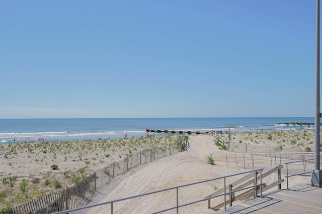 property view of water featuring a beach view