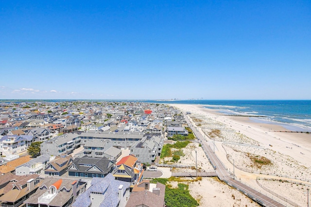 aerial view with a water view, a residential view, and a view of the beach