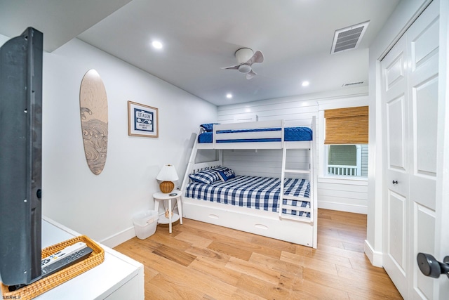 bedroom featuring baseboards, visible vents, a ceiling fan, wood finished floors, and recessed lighting