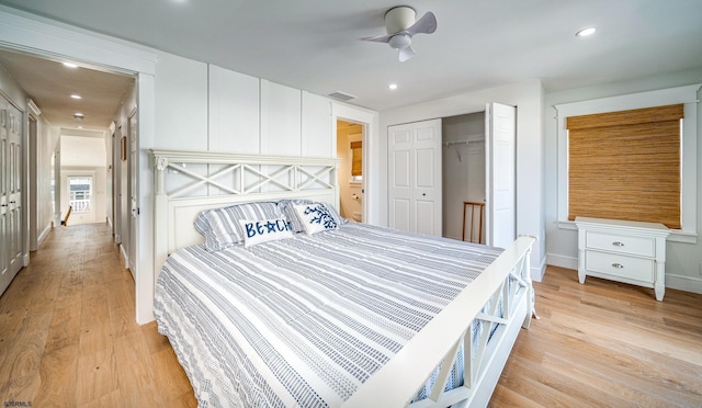 bedroom featuring visible vents, a closet, light wood-style flooring, and recessed lighting