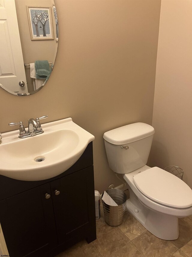 bathroom with toilet and vanity