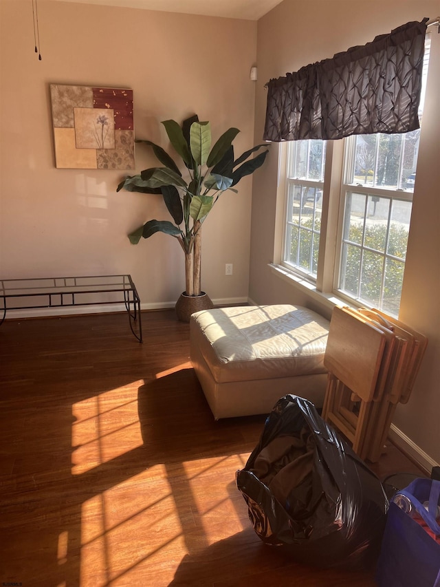 bedroom featuring baseboards and wood finished floors