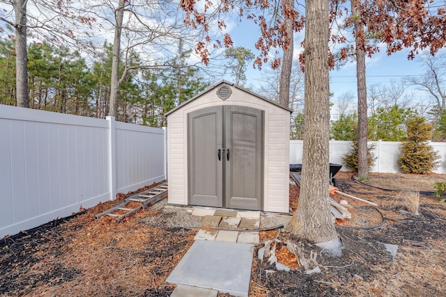view of shed featuring a fenced backyard