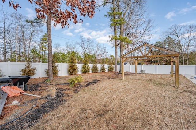 view of yard featuring a fenced backyard and a gazebo