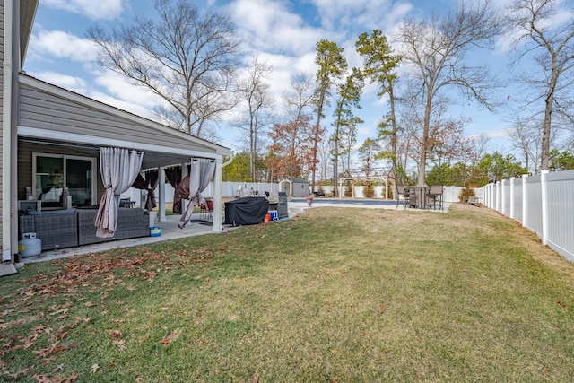 view of yard with a swimming pool, a fenced backyard, and a patio
