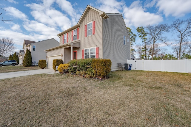 view of front of home with driveway, a front yard, fence, and a garage