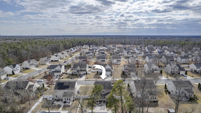 bird's eye view with a residential view and a view of trees