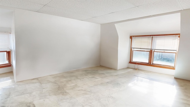 unfurnished room with a paneled ceiling