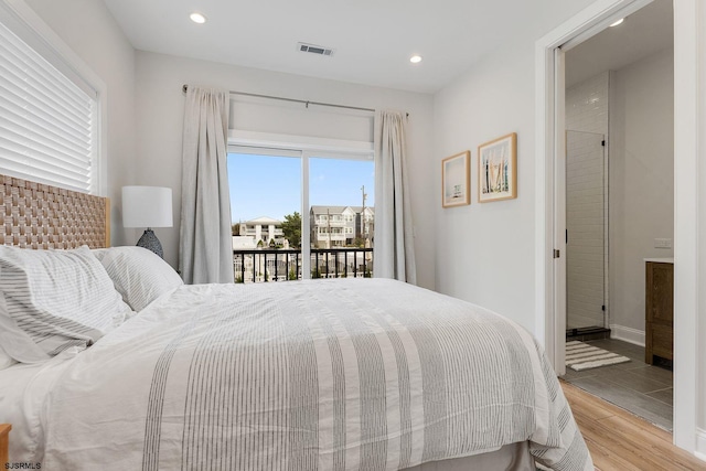 bedroom with access to exterior, recessed lighting, visible vents, light wood-style floors, and baseboards