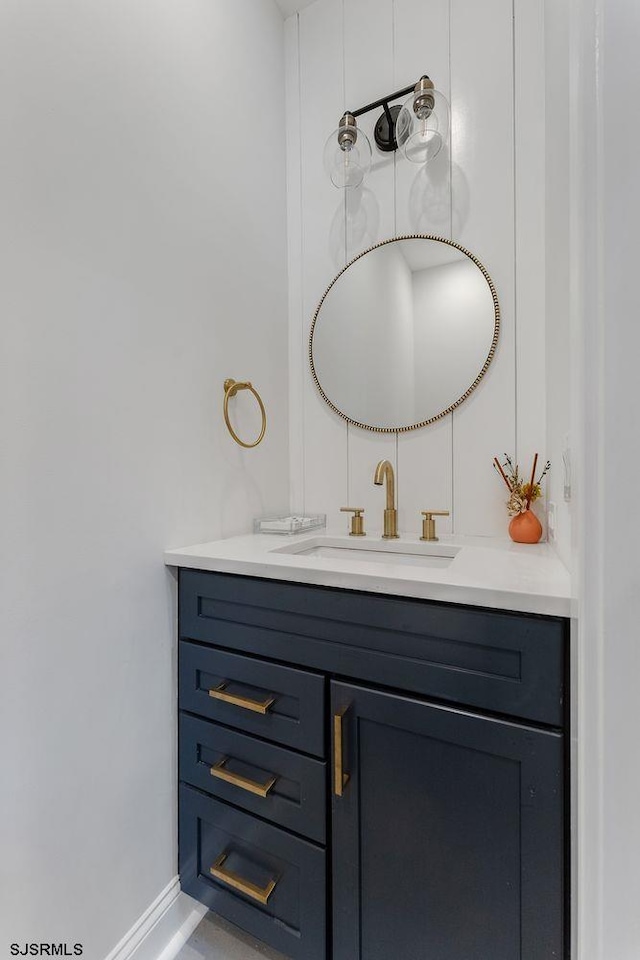 bathroom featuring vanity and baseboards