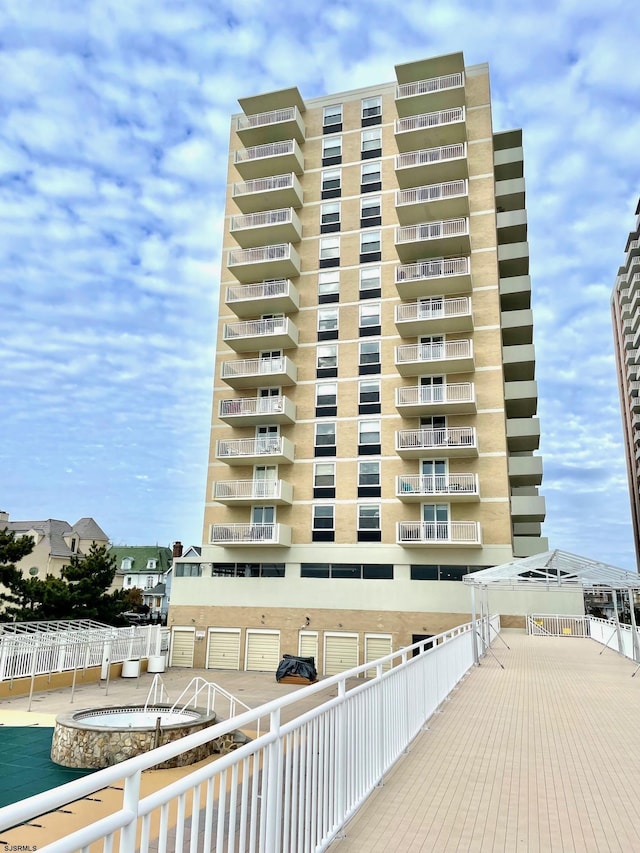 view of building exterior with fence