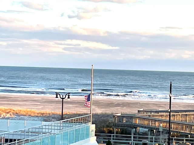 property view of water featuring a beach view