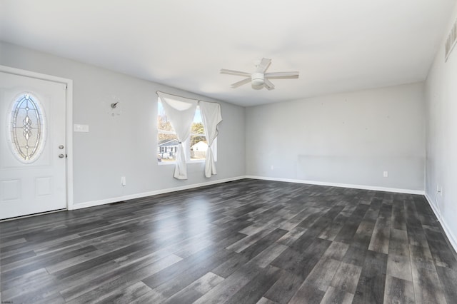 entryway featuring dark wood-type flooring, baseboards, and a ceiling fan