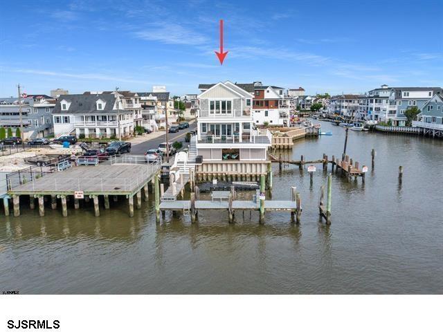 view of dock featuring a water view and boat lift