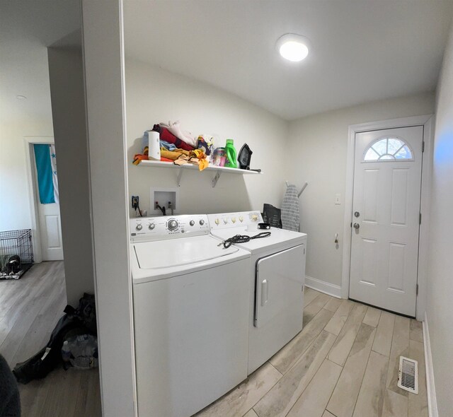200 E Park Ave, Pleasantville, NJ 08232 - washroom with light wood-style flooring, laundry area, visible vents, baseboards, and washer and clothes dryer