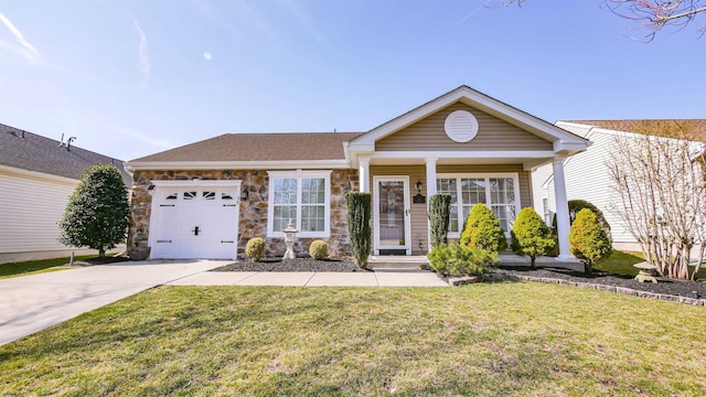 ranch-style house with a garage, a front yard, stone siding, and driveway