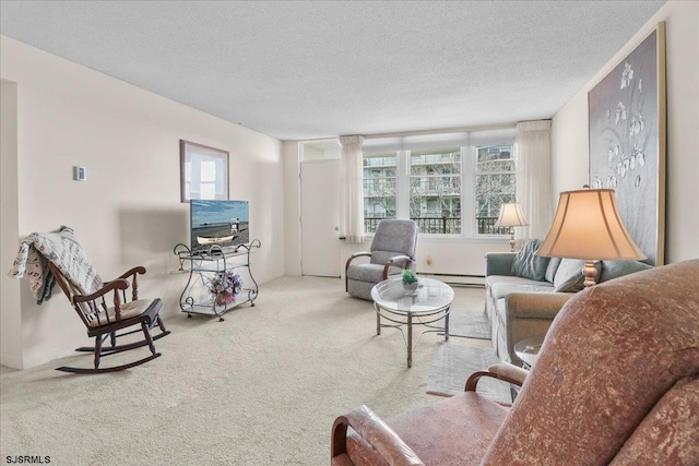 carpeted living area with a healthy amount of sunlight, a baseboard heating unit, and a textured ceiling