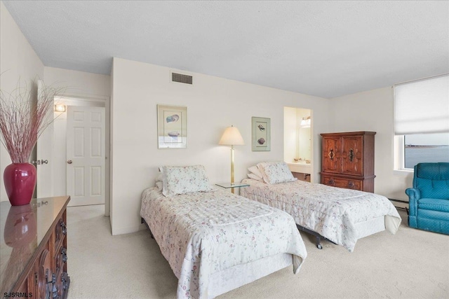 bedroom featuring a baseboard radiator, visible vents, and light colored carpet