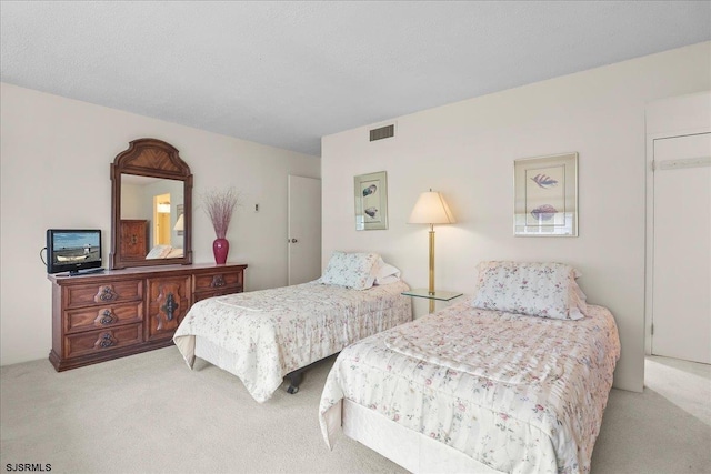 carpeted bedroom with visible vents