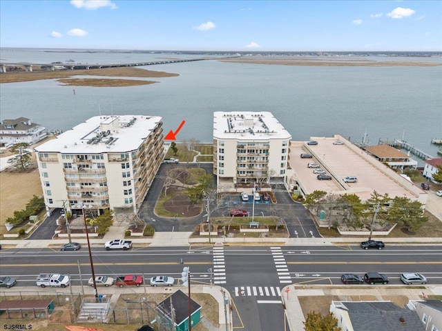 birds eye view of property featuring a water view