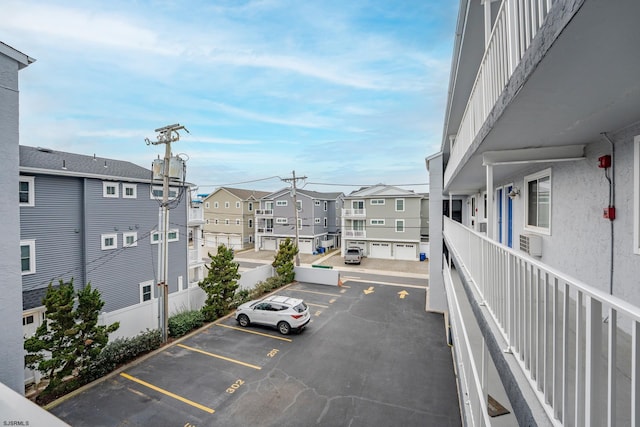 uncovered parking lot with a residential view