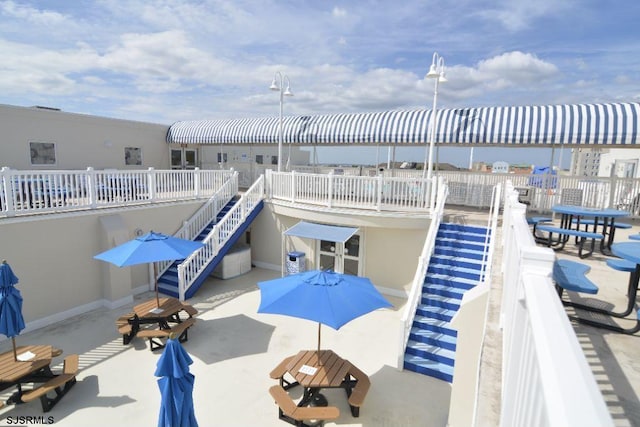 view of swimming pool with stairway