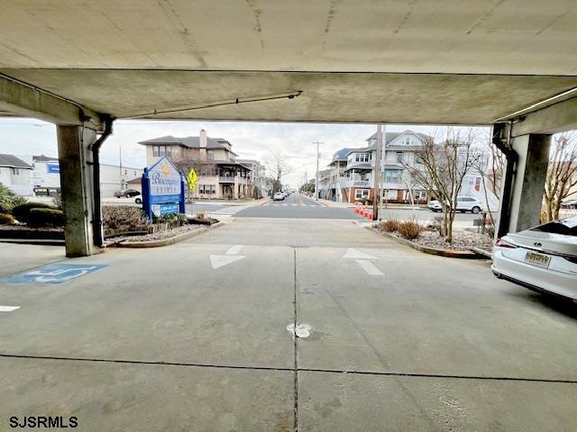 view of street with curbs and a residential view