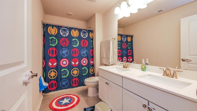 full bath featuring tile patterned flooring, a sink, toilet, and double vanity