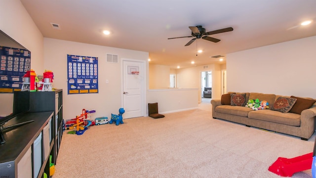 living room with recessed lighting, visible vents, ceiling fan, and carpet flooring