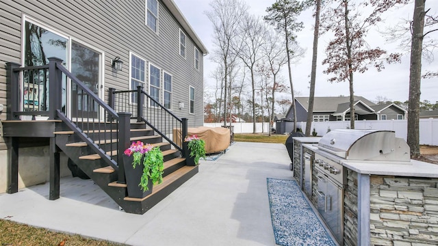 view of patio with a fenced backyard, a grill, and area for grilling