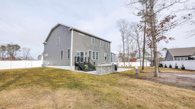 rear view of house featuring central AC, a lawn, a patio area, and a fenced backyard