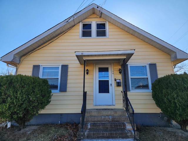 bungalow-style home featuring entry steps