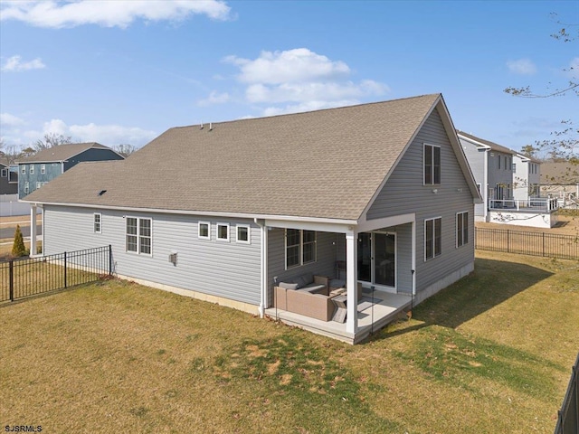 back of house featuring a patio area, a fenced backyard, a shingled roof, and a lawn