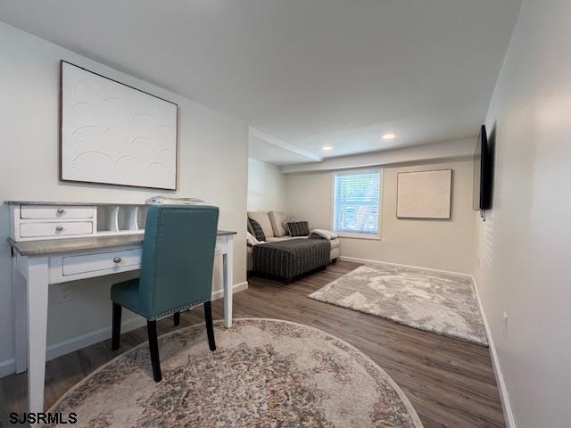 office space with recessed lighting, baseboards, and wood finished floors