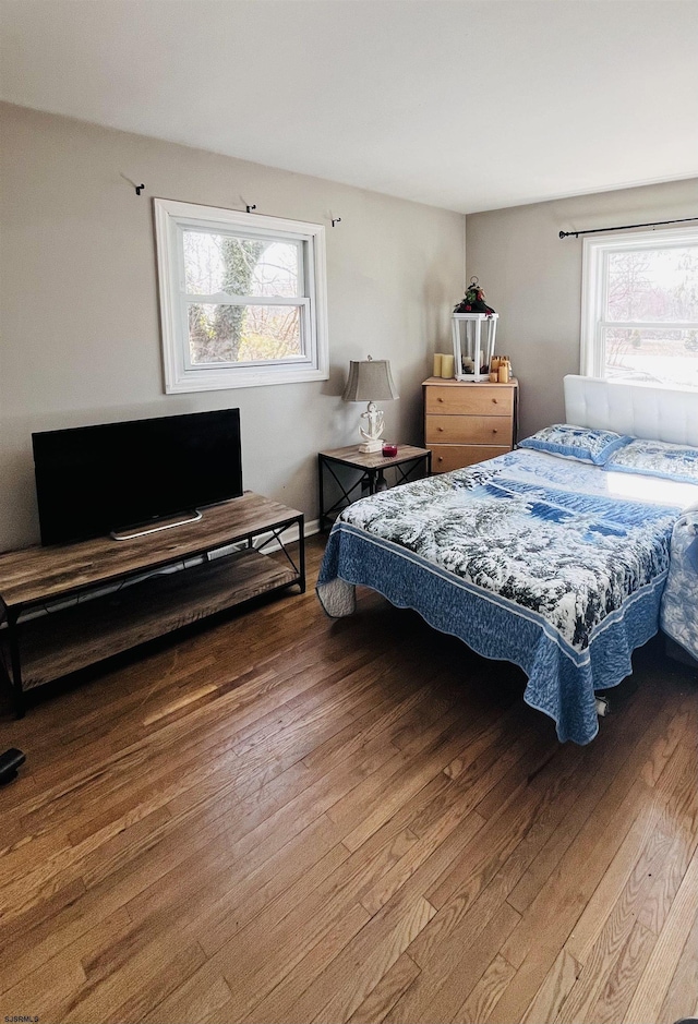 bedroom featuring wood finished floors