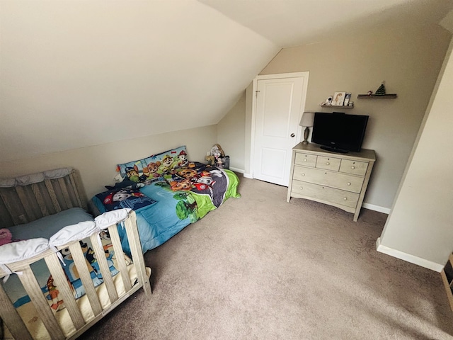 bedroom featuring carpet, lofted ceiling, and baseboards