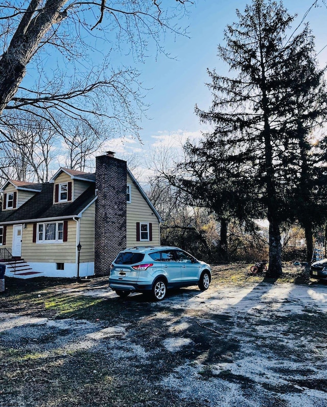 view of side of home with a chimney