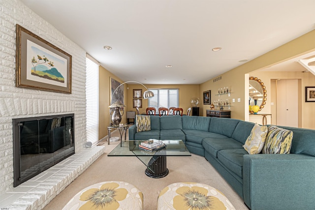 carpeted living room with recessed lighting, visible vents, a fireplace, and a dry bar